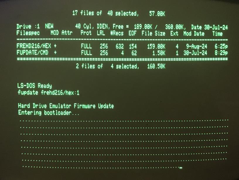 A computer screen with green text Description automatically generated